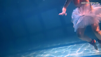 Bulava Lozhkova In Red Attire Poses Underwater