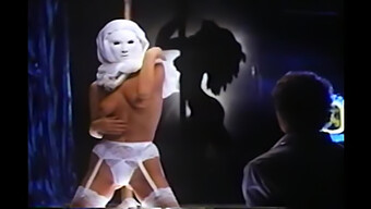 Stripper Performs In A Mask And Restrains A Man With A Choke Hold